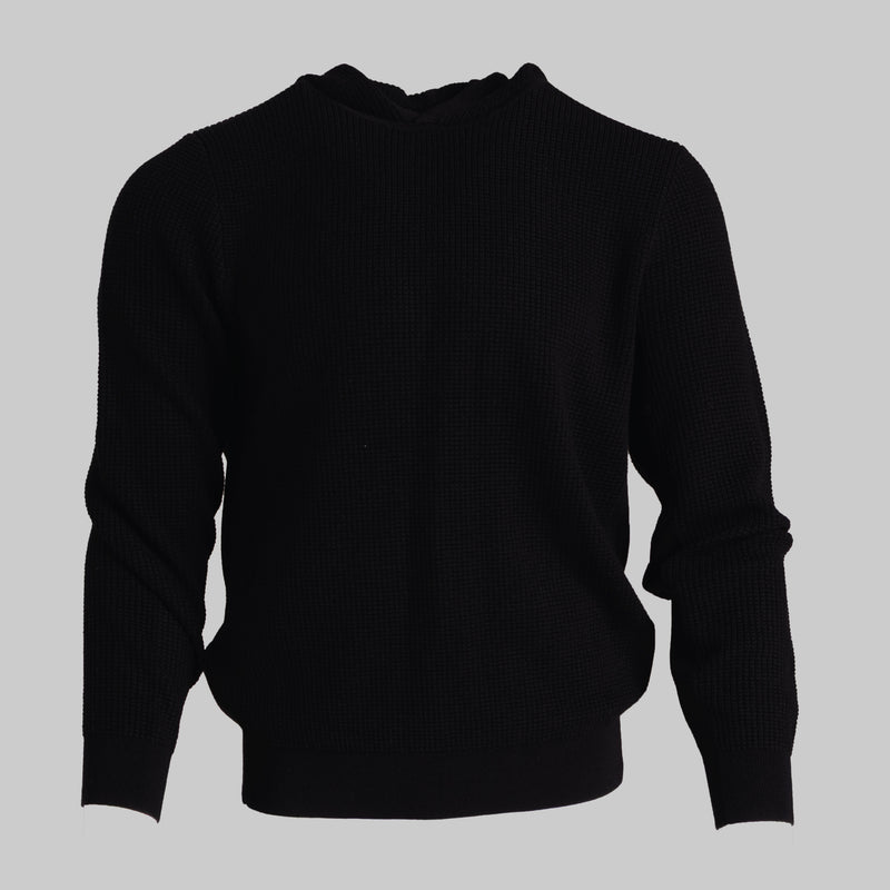 A black ribbed knit sweater with a crew neck, displayed on a neutral gray background.